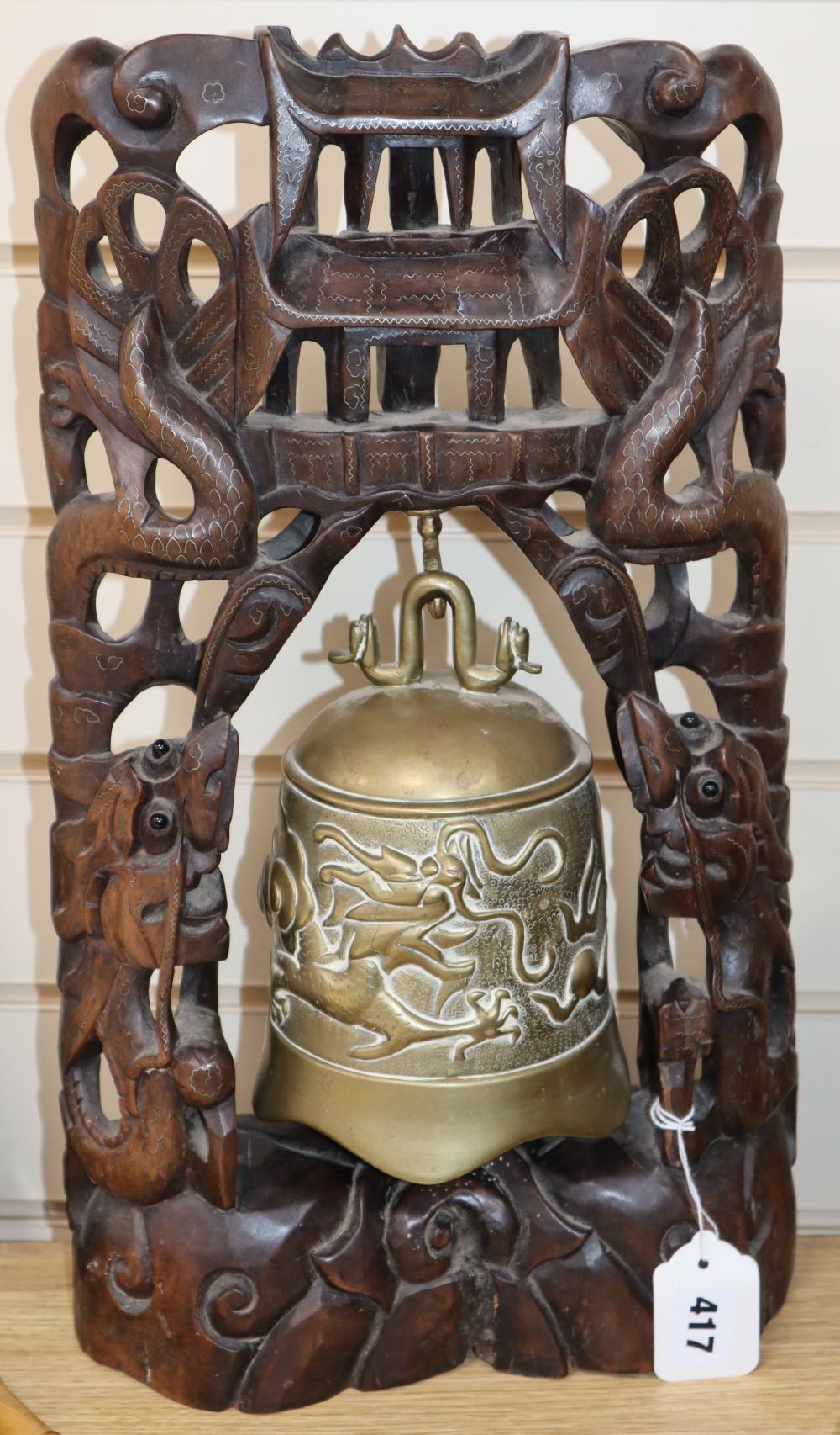 A Chinese gong and beater with hardwood stand